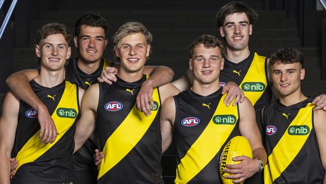 MELBOURNE, AUSTRALIA - NOVEMBER 21: Richmond draftees (L-R) Luke Trainor, Harry Armstrong, Josh Smillie, Sam Lalor, Jonty Faull and Taj Hotton pose for a photograph during the 2024 AFL Draft at Marvel Stadium on November 21, 2024 in Melbourne, Australia. (Photo by Daniel Pockett/Getty Images)