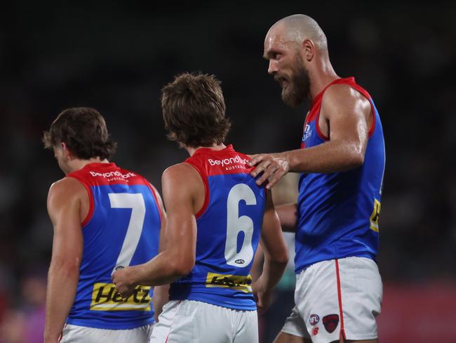 MELBOURNE, AUSTRALIA - FEBRUARY 28: Max Gawn of the Demons (R) celebrates a goal to Caleb Windsor of the Demons (C) during the 2024 AFL Community Series match between Carlton Blues and Melbourne Demons at Ikon Park on February 28, 2024 in Melbourne, Australia. (Photo by Daniel Pockett/Getty Images)