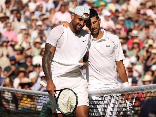 LONDON, ENGLAND - JULY 10: Winner Novak Djokovic of Serbia (L) and runner up Nick Kyrgios of Australia interact by the net following their Men's Singles Final match day fourteen of The Championships Wimbledon 2022 at All England Lawn Tennis and Croquet Club on July 10, 2022 in London, England. (Photo by Ryan Pierse/Getty Images)