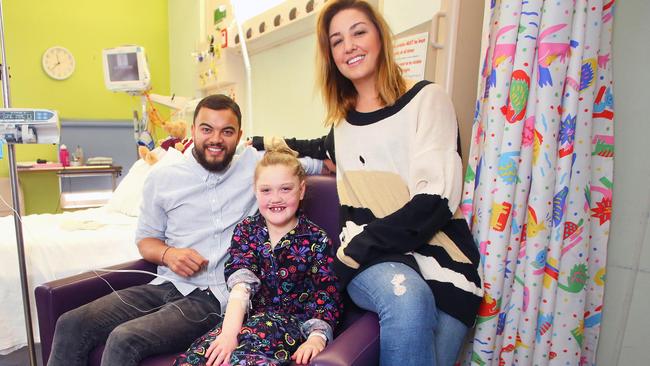 Jules and Guy Sebastian visit Rachel Irvin, 9, at Sydney Children’s Hospital as part of their work with their charity, Sebastian Foundation.