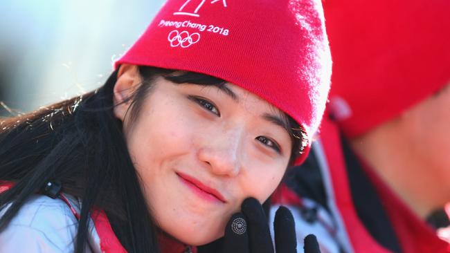 A volunteer smiles during the Pyeongchang 2018 Olympic Village opening ceremony. Picture: Alexander Hassenstein/Getty Images