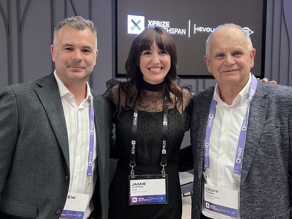 Andrew and Geoff Keipert flanking XPrize Executive Vice President Jamie Justice.