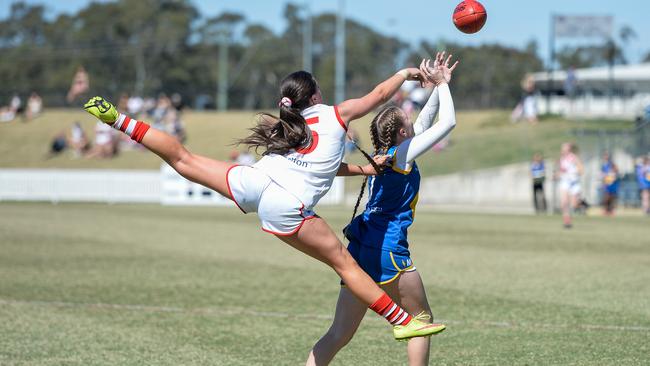 St George player Erin Wardrop goes full stretch for the ball.