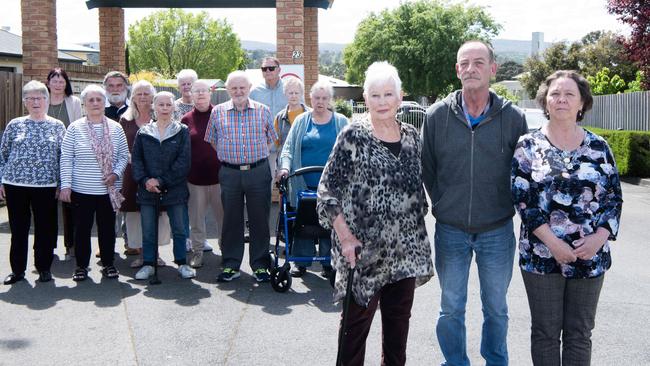 Liz Stark, Michael Cullen and Leanne Crawford with fellow residents in front of Eureka Launceston Gardens retirement village. Picture: Sarah Rhodes