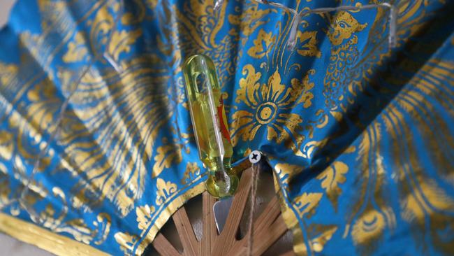 A knife stuck in a fan seen inside Belinda Marriott unit in a housing commission complex 7-5 Levitt street dubbed “The Ice Palace“ Wyong, where a murder was discovered in a neighbouring apartment last week. Belinda has weapons stashed in her bedroom for protection. Picture: John Grainger