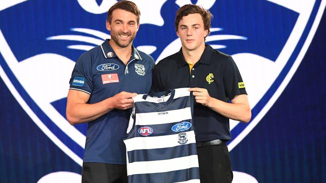 Jordan Clark is presented with his jumper at the AFL draft. Picture: AAP Images 