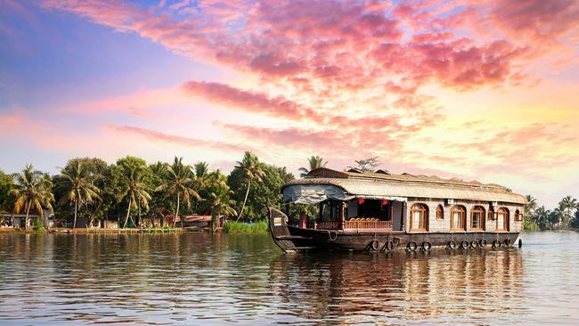 Cruising Kerala's Backwaters on a kettuvallam house boat.