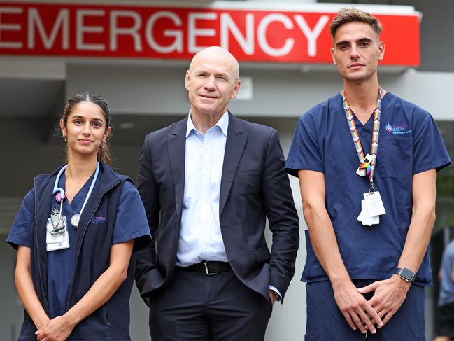 SATURDAY TELEGRAPH. MARCH 15, 2024.Pictured outside the Emergency Entrance at St Vincents Hospital today is Associate Professor, Dr Paul Preisz, with Nurses Zenaida Dorabjee and Darren Scott. Picture: Tim Hunter.