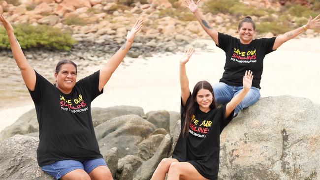 Protesters, from left, Josie Alec, Denae Cooper and Raelene Cooper are advocating for the protection of a culturally significant area containing Indigenous rock art in the Pilbara region of Western Australia.