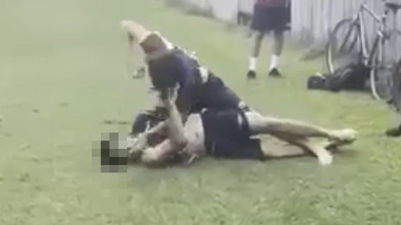 Brutal fight between two Mackay State High School students. One teen unleashes about nine blows to the other teen's head.