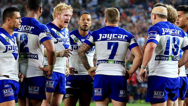 Moses Mbye (centre) was playing just his ninth NRL game in the 2014 grand final against South Sydney. Photo: Mark Evans
