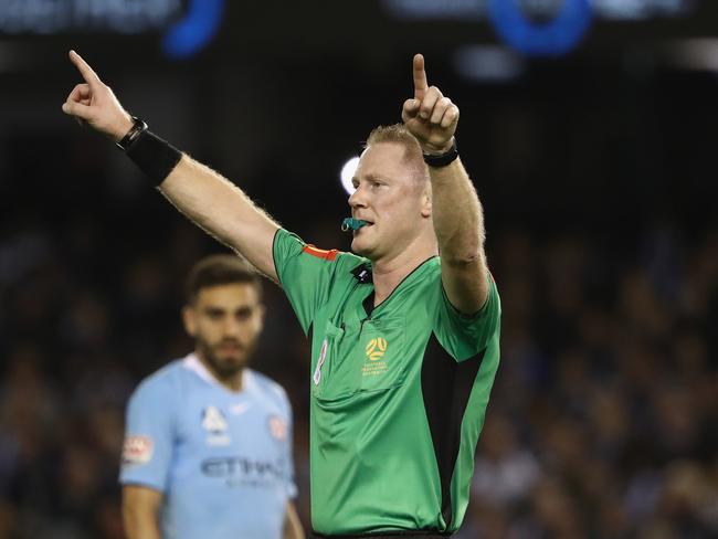 MELBOURNE, AUSTRALIA - OCTOBER 20: Referee Kurt Ams signals for the VAR during the round one A-League match between Melbourne Victory and Melbourne City at Marvel Stadium on October 20, 2018 in Melbourne, Australia.  (Photo by Robert Cianflone/Getty Images)