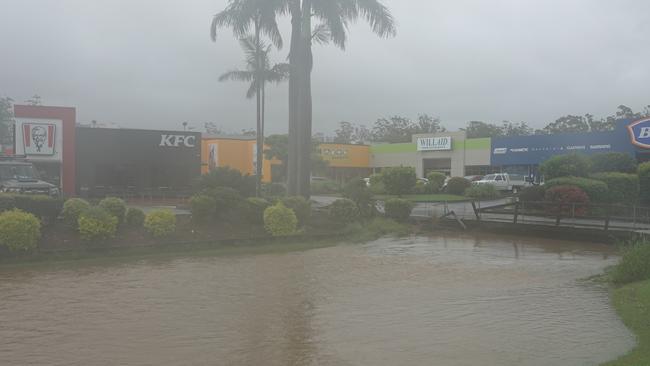 The culvert alongside KFC off North Boambee Road was awash. Picture: Chris Knight