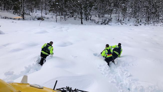 Police attempt to tackle the deep snow in the search for Michael Bowman. Picture: TASMANIA POLICE