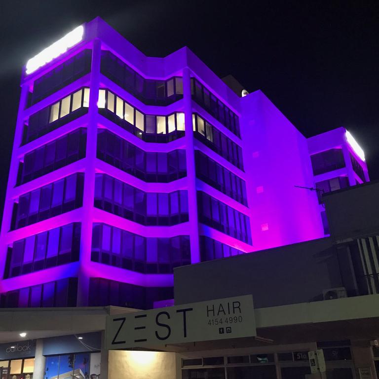 The Auswide building has been changing colours.