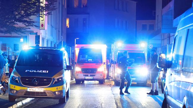 Police and ambulances stand near the scene where a several people died and several were injured in an attack. Picture: Gianni Gattus / DPA / AFP