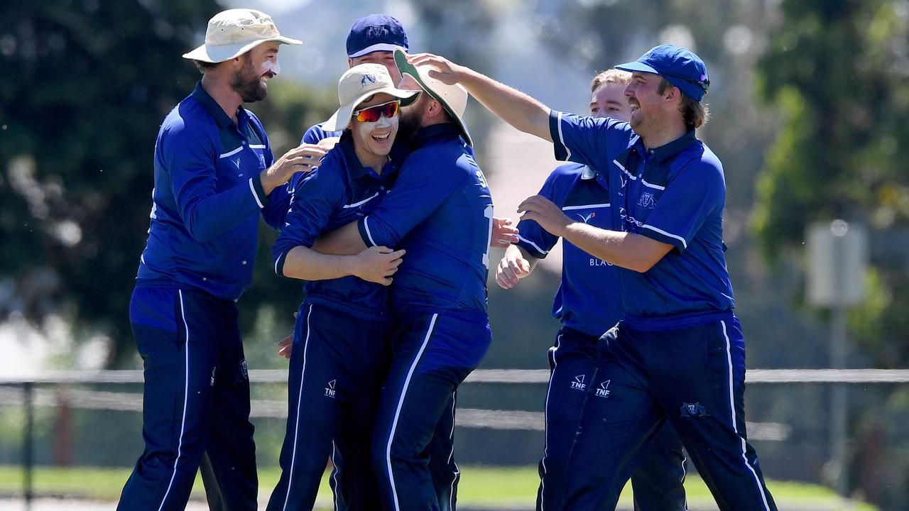 VSDCA - Mt Waverley’s Angus Robbins is mobbed by teammates after a run out. Picture: Andy Brownbill