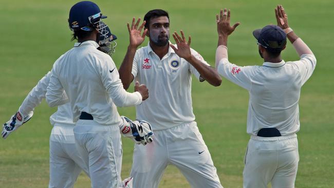 India’s Ravichandran Ashwin (C) celebrates a wicket against West Indies.