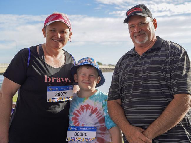 Jodie Watt, Lane Watt, 7, and Alan Richter at the Mackay Mother's Day Classic fun run 2021. Ms Watt said they were there in support of her mum and sister-in-law. Heidi Petith