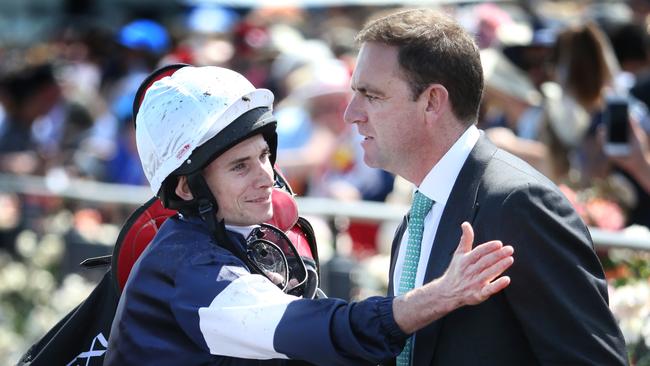 The Cliffsofmoher jockey Ryan Moore congratulates winning trainer Charlie Appleby. Picture: David Caird