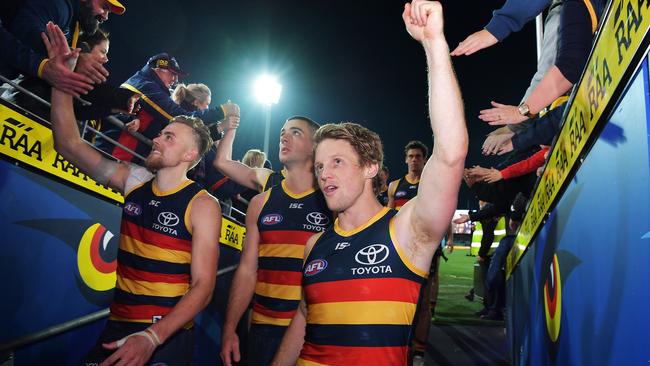 Rory Sloane of the Crows celebrates with fans a home win against the West Coast Eagles in 2018. Picture: Daniel Kalisz/Getty Images