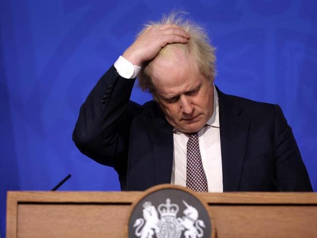 (FILES) In this file photo taken on November 27, 2021 Britain's then prime minister Boris Johnson gestures as he attends a media briefing on the latest Covid-19 update in the Downing Street briefing room in central London. Johnson announced his resignation as an MP on June 9, 2023, accusing a parliamentary probe into the "Partygate" scandal of driving him out. Johnson, 58, said he was stepping down with immediate effect "triggering an immediate by-election" in his marginal seat, which heaps political pressure on his successor Rishi Sunak. (Photo by Hollie Adams / POOL / AFP)