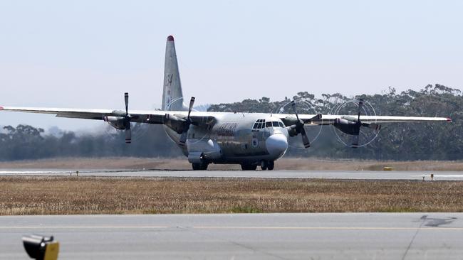 The Coulson C-130 water bomber from the New South Wales Fire Fighting Aviation Division takes off from Hobart Airport. Picture: LUKE BOWDEN