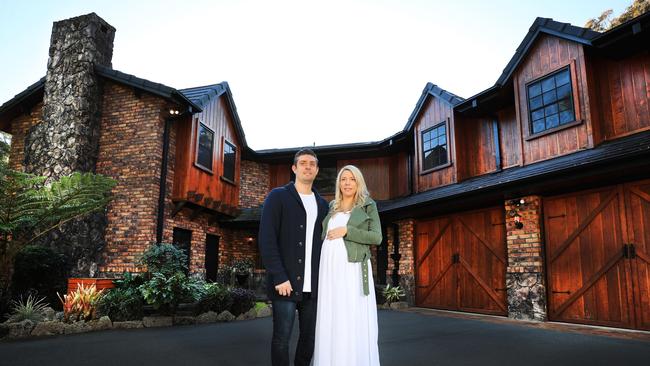 Nick and wife Katie in front of their Gold Coast house. Photo Scott Powick Newscorp