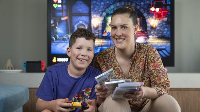 Melissa McDonald and son John gaming together at home in Canberra. Picture: NCA NewsWire / Martin Ollman