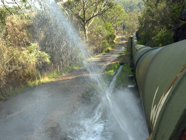 Water escaping from Sydney Water pipeline from Heathcote to Engadine showed up to 100 leaks from a trickle to a torrent, 30/10/2002.