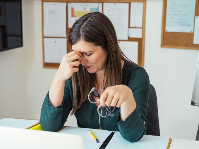 Teacher holding online class for e-learning students during covid-19 pandemic period. Stressed woman sitting in her home office during class break, take off glasses feel pain rub closed eyes tired of computer screen.