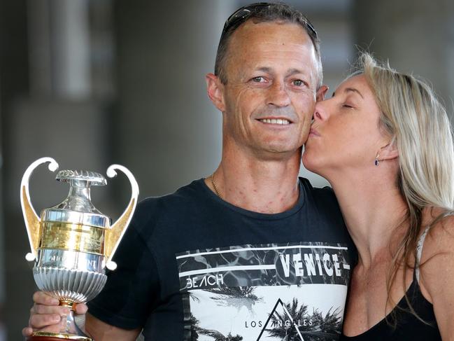 Jockey Damian Browne and his wife Kim celebrate his big win on Buffering after arriving back in Brisbane. Pic Darren England.