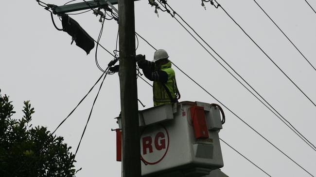  Photo is of Energex workers restoring power to Tamborine Mountain.