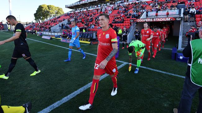 Captain Michael Jakobsen, one of five Adelaide United players off-contract next month, leads the Reds out for their final match before the season hiatus. Picture: Mark Brake/Getty Images