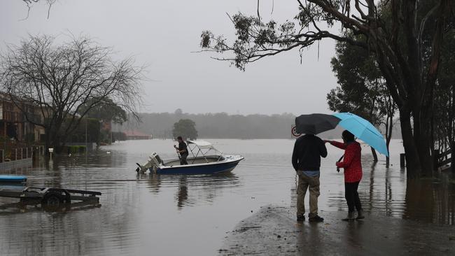 Residents in flood-stricken areas have resorted to travelling via boat. Picture: John Grainger