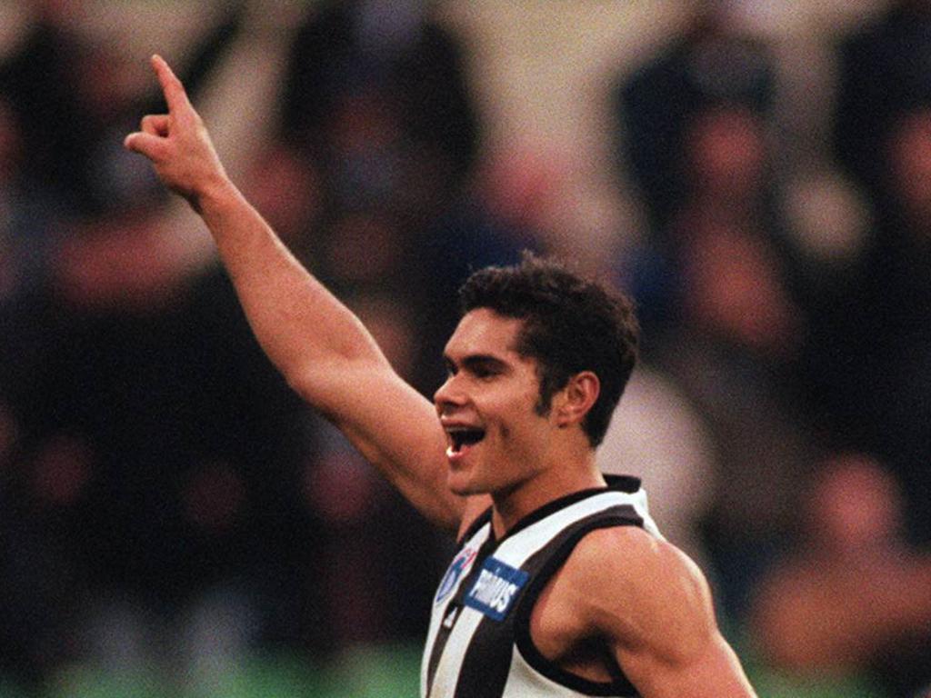 Mal Michael celebrates a rare goal as a Magpie.