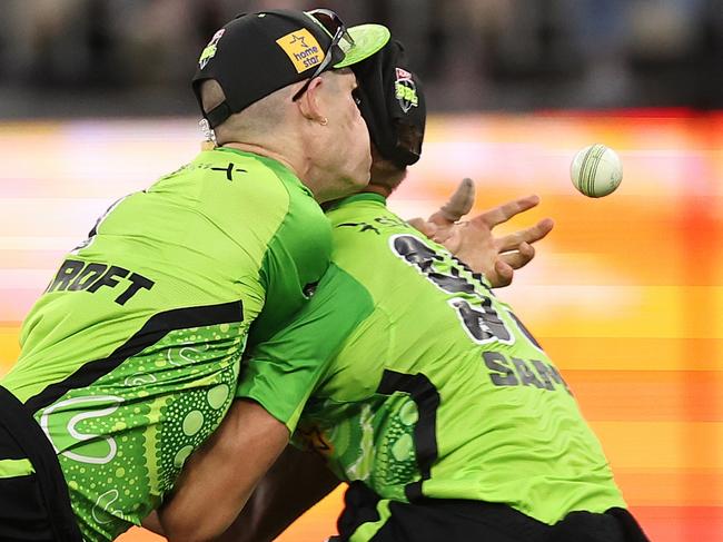 PERTH, AUSTRALIA - JANUARY 03: Cameron Bancroft and Daniel Sams of the Thunder collide while attempting to catch the ball during the BBL match between Perth Scorchers and Sydney Thunder at Optus Stadium, on January 03, 2025, in Perth, Australia. (Photo by Paul Kane/Getty Images)