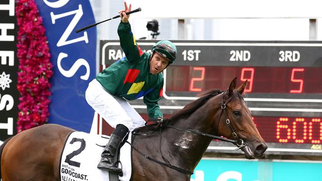 Ryan Maloney celebrates after riding Alligator Blood to victory in the Magic Millions 3YO Guineas.