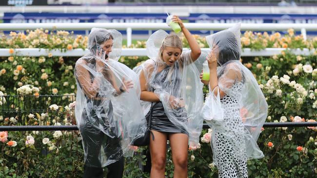 Revellers enjoying the day despite the rain. Picture: Alex Coppel.