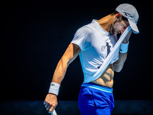 Serbia's Novak Djokovic attends a practice session ahead of the Australian Open tennis tournament in Melbourne on January 12, 2023. (Photo by Patrick HAMILTON / AFP) / -- IMAGE RESTRICTED TO EDITORIAL USE - STRICTLY NO COMMERCIAL USE --