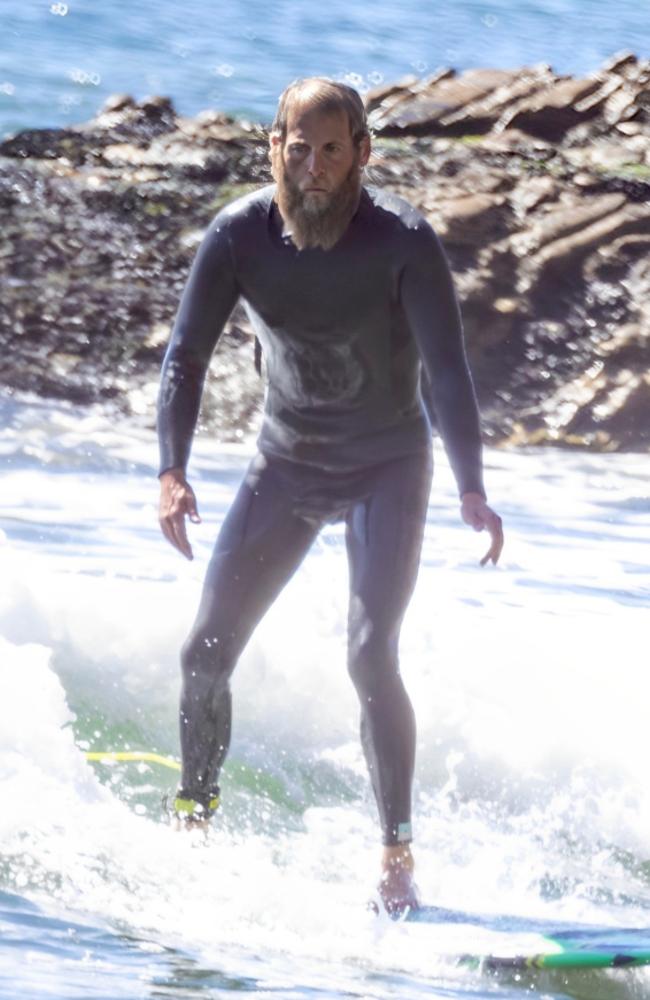 Hollywood star Jonah Hill looked noticeably slimmer when spotted surfing in Malibu. Picture: Splash News/Media Mode