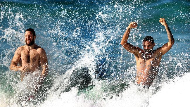 Hawks players James Frawley and Shaun Burgoyne swim at Coogee beach in Sydney after their game against the Giants. Picture: Phil Hillyard.