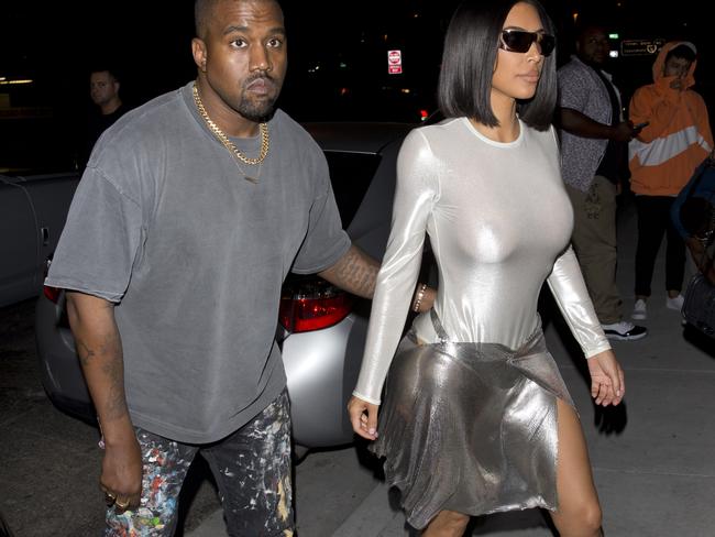 Kim donned the revealing futuristic outfit as the couple attended an event for fashion photographer Marcus Hyde in Los Angeles.