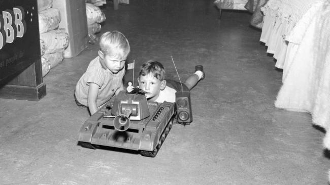 Garry Knight and Tony Thorne toy shopping in a department store at Christmas time in 1966. 