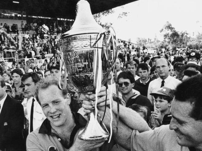 Jeff Miller hoisting the trophy after beating Wales at Ballymore.