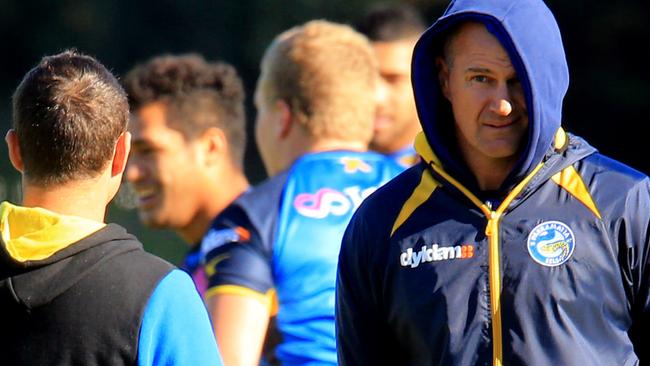 Brad Arthur watches as Eels players warm up at the Clubs North Parramatta training ground. pic Mark Evans