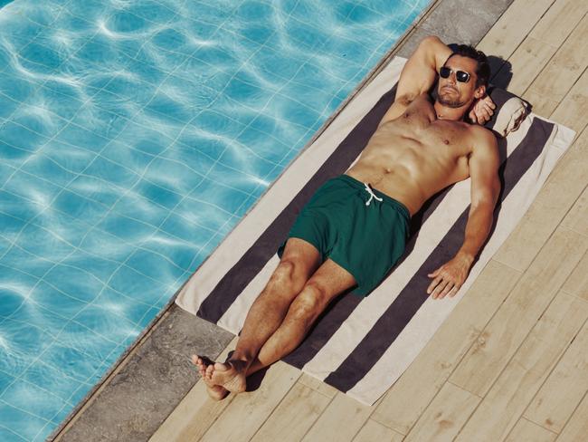 EMBARGO FOR WISH MAGAZINE. 06 DECEMBER 2024. Exchange - Long Hot Summer. Entrepreneur David Gandyrelaxes in his David Gandy Wellwear swim shorts. Photo: Supplied