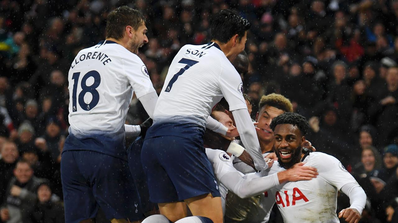 Christian Eriksen of Tottenham Hotspur celebrates with teammates after scoring his team's first goal