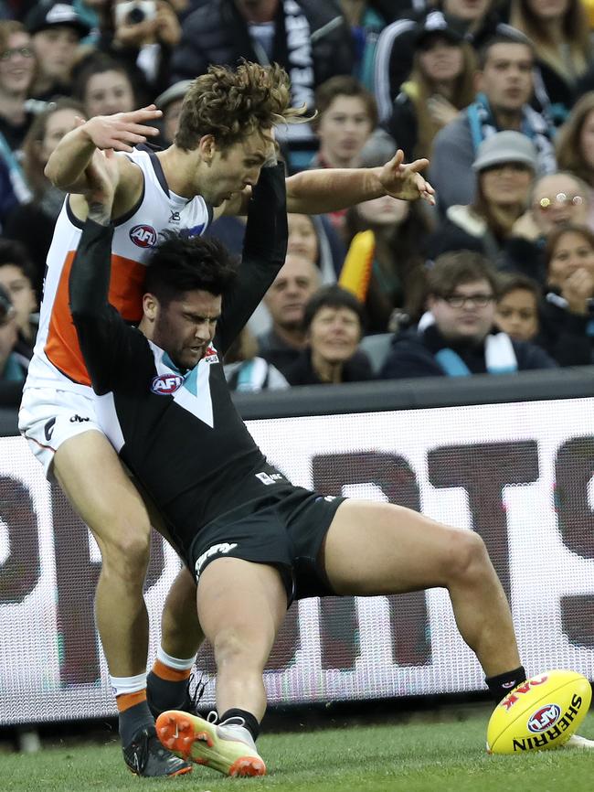 Chad Wingard tries to hold off Matt Buntine. Picture: Sarah Reed