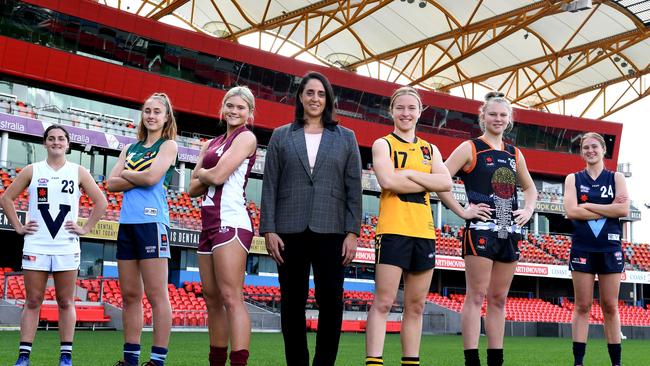 Players pose for a portrait at Metricon Stadium on July 07, 2019 in Gold Coast, Australia. (Photo by Bradley Kanaris/Getty Images via AFL Photos). From left: Lucy McEvoy (Vic Country), Georgia Garnett (Eastern Allies), Lily Postlethwaite (QLD), Nicole Livingstone (AFL Head of Women’s Football), Mikayla Bowen (Western Australia), Montana McKinnon (Central Allies), Isabella Grant (Vic Metro)